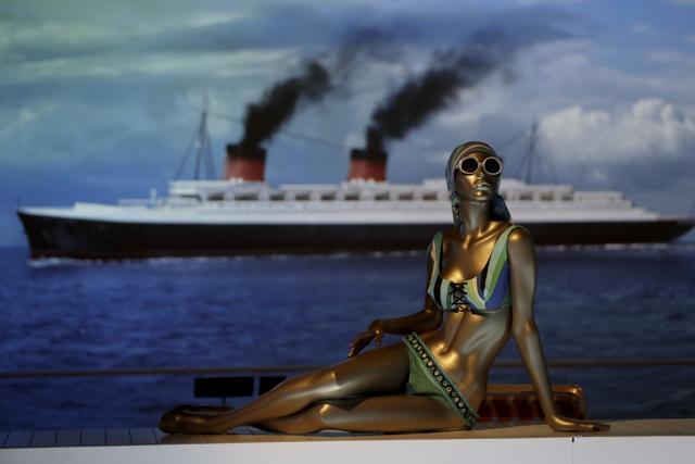 A mannequin displays an Emilio Pucci bikini from 1968, made for Saks Fifth Avenue, as part of a bathing suit installation featuring the backdrop of an ocean liner moving across a screen. (AP) A mannequin displays an Emilio Pucci bikini from 1968, made for Saks Fifth Avenue, as part of a bathing suit installation featuring the backdrop of an ocean liner moving across a screen. (AP)