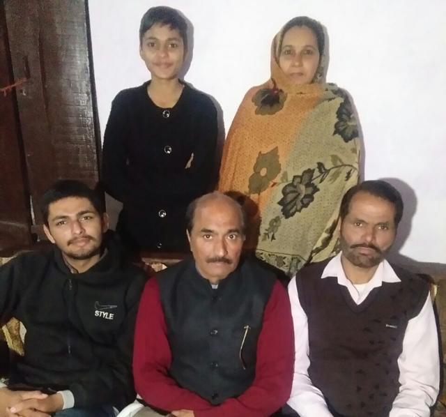 Vinod Kumar Sharma (centre) with his family in Panchkula. (HT Photo) Vinod Kumar Sharma (centre) with his family in Panchkula. (HT Photo)