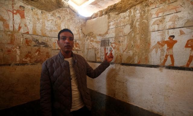 A guide from the ministry of Antiquities inspects a discovery from Egypt’s antiquities authorities at the Giza plateau. (REUTERS) A guide from the ministry of Antiquities inspects a discovery from Egypt’s antiquities authorities at the Giza plateau. (REUTERS)