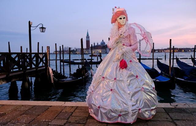 A masked reveller poses during the Venice Carnival in Venice. (REUTERS) A masked reveller poses during the Venice Carnival in Venice. (REUTERS)