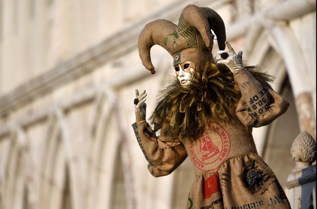 A masked reveller wearing a traditional carnival costume. (AFP) A masked reveller wearing a traditional carnival costume. (AFP)
