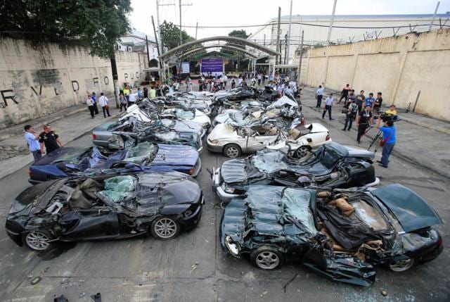 A bulldozer destroys condemned smuggled luxury cars worth 61,626,000.00 pesos (approximately US$1.2 million), which include used Lexus, BMW, Mercedes-Benz, Audi, Jaguar and Corvette Stingray in Metro Manila, the Philippines, on February 6, 2018. (Reuters) A bulldozer destroys condemned smuggled luxury cars worth 61,626,000.00 pesos (approximately US$1.2 million), which include used Lexus, BMW, Mercedes-Benz, Audi, Jaguar and Corvette Stingray in Metro Manila, the Philippines, on February 6, 2018. (Reuters)