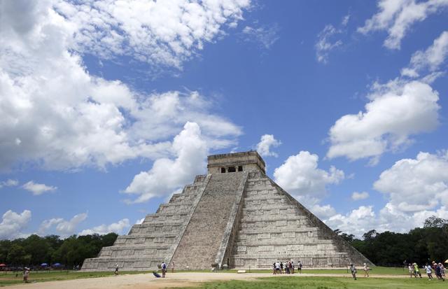 People are dwarfed by El Castillo at the Chichen-Itza ruins in Yucatan, Mexico. (AP) People are dwarfed by El Castillo at the Chichen-Itza ruins in Yucatan, Mexico. (AP)