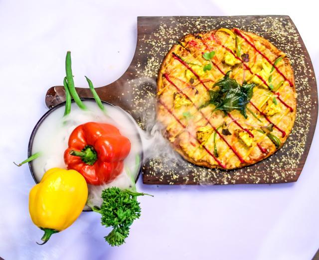 Paneer tikka pizza is a vegetarian’s delight. Paneer tikka pizza is a vegetarian’s delight.