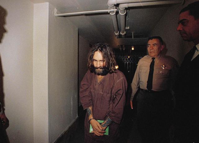 In this 1969 file photo, Charles Manson is escorted to court in Los Angeles during an arraignment phase. (AP) In this 1969 file photo, Charles Manson is escorted to court in Los Angeles during an arraignment phase. (AP)