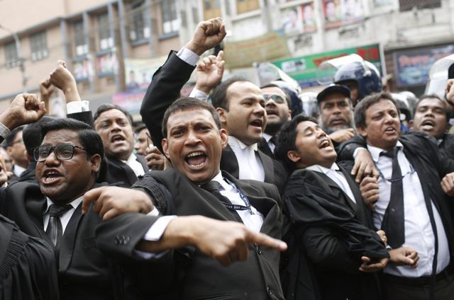 Supporters of Bangladesh Nationalist Party (BNP) shout slogans outside the court in Dhaka. (AP) Supporters of Bangladesh Nationalist Party (BNP) shout slogans outside the court in Dhaka. (AP)