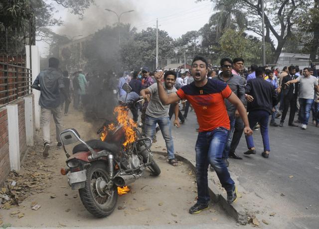 Supporters of opposition Bangladesh Nationalist Party (BNP) set fire to a motorcycle as they protest against a verdict against opposition leader and former Prime Minister Khaleda Zia in Dhaka on February 8. (AP Photo)