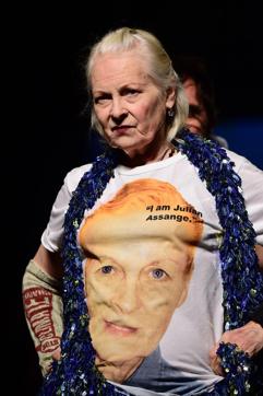 Designer Vivienne Westwood wears a T-shirt reading I am Julian Assange as she walks the runway at the end of her show during the Men's Spring-Summer 2017 fashion shows in Milan. (AFP) Designer Vivienne Westwood wears a T-shirt reading I am Julian Assange as she walks the runway at the end of her show during the Men's Spring-Summer 2017 fashion shows in Milan. (AFP)