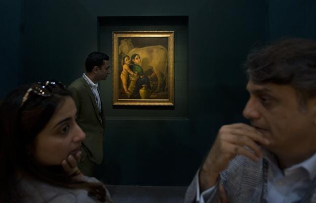 Visitors stand next to a Raja Ravi Varma painting. (AP/Manish Swarup) Visitors stand next to a Raja Ravi Varma painting. (AP/Manish Swarup)