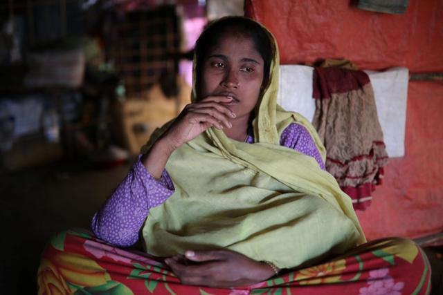Shuna Khatu, 30, whose husband Habizu was among 10 Rohingya men killed by Myanmar security forces and Buddhist villagers on September 2, 2017, poses for a picture at Balukhali camp in Cox's Bazar, Bangladesh, January 20. (Reuters Photo) Shuna Khatu, 30, whose husband Habizu was among 10 Rohingya men killed by Myanmar security forces and Buddhist villagers on September 2, 2017, poses for a picture at Balukhali camp in Cox's Bazar, Bangladesh, January 20. (Reuters Photo)