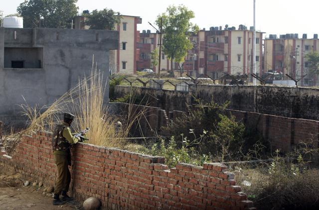 A security personnel stands guard on the periphery of Sunjwan Army camp in Jammu. (AP Photo) A security personnel stands guard on the periphery of Sunjwan Army camp in Jammu. (AP Photo)