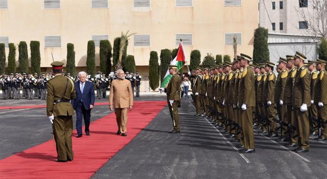 Prime Minister Narendra Modi and Palestinian President Mahmoud Abbas accord a ceremonial guard of honour at Al-Muqata'a, compound of the presidential headquarters in Ramallah on February 10. (PTI Photo) Prime Minister Narendra Modi and Palestinian President Mahmoud Abbas accord a ceremonial guard of honour at Al-Muqata'a, compound of the presidential headquarters in Ramallah on February 10. (PTI Photo)
