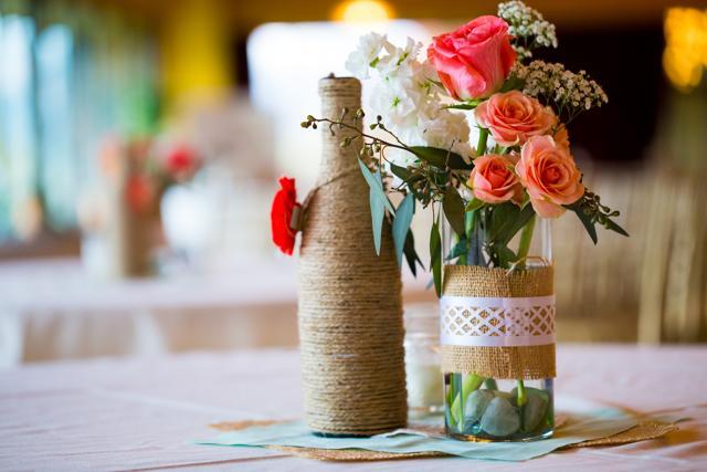 Make flower vases with wine bottles wrapped in burlap twine or jute. (iStock) Make flower vases with wine bottles wrapped in burlap twine or jute. (iStock)