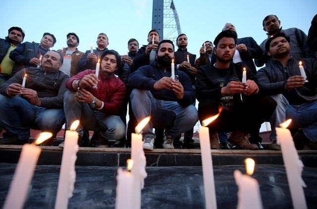People light candles during a vigil held for the army officers who were killed in an attack earlier this morning at an army camp in Jammu. (Reuters Photo) People light candles during a vigil held for the army officers who were killed in an attack earlier this morning at an army camp in Jammu. (Reuters Photo)