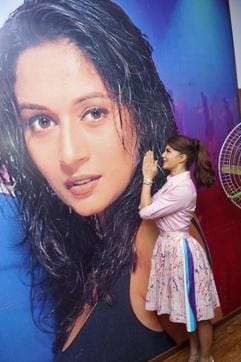 Jacqueline Fernandez with a poster of Madhuri Dixit. (IANS) Jacqueline Fernandez with a poster of Madhuri Dixit. (IANS)