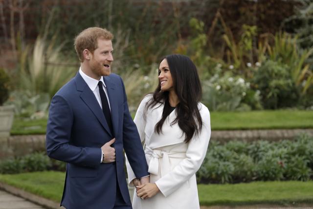 FILE - In this file photo dated Monday Nov. 27, 2017, Britain's Prince Harry and his fiancee Meghan Markle pose for photographers in the grounds of Kensington Palace in London, following the announcement of their engagement. (AP)