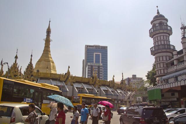 People walk past the Sule Pagoda, left, in downtown Yangon, Myanmar. (AP Photo) People walk past the Sule Pagoda, left, in downtown Yangon, Myanmar. (AP Photo)