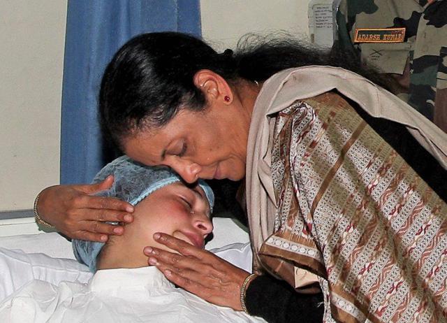 Defence minister Nirmala Sitharaman hugs a person wounded in the militant attack at Sunjuwan army camp, in a military hospital in Jammu on Monday. (PTI) Defence minister Nirmala Sitharaman hugs a person wounded in the militant attack at Sunjuwan army camp, in a military hospital in Jammu on Monday. (PTI)