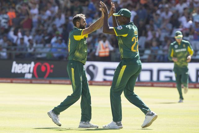 Imran Tahir, left, celebrates with Lungi Ngidi, right, after they took the wicket of MS Dhoni. (AP) Imran Tahir, left, celebrates with Lungi Ngidi, right, after they took the wicket of MS Dhoni. (AP)