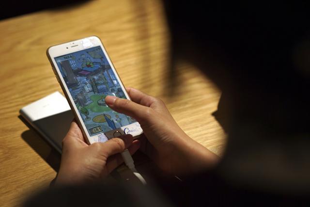 The Japanese mobile game has attracted a massive following in China. (AP)