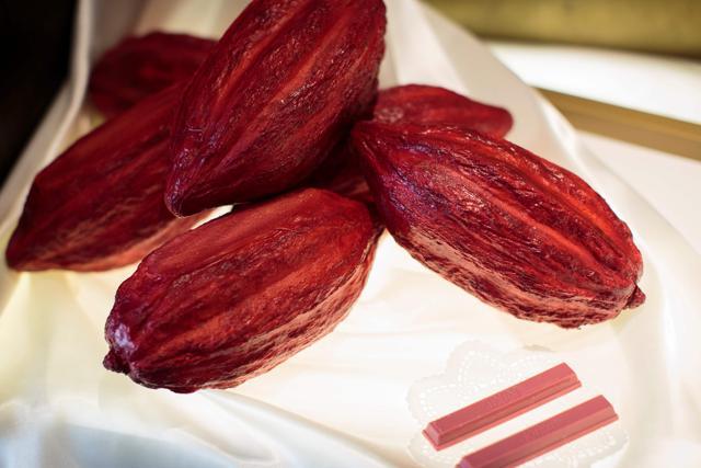 Ruby KitKat bars, made of pink ruby chocolate, next to mock cocoa beans at a KitKat chocolatory shop in Tokyo. (AFP) Ruby KitKat bars, made of pink ruby chocolate, next to mock cocoa beans at a KitKat chocolatory shop in Tokyo. (AFP)