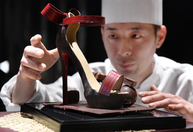 Japanese patissier Kazuya Nagata checking his work "Dear Myself", a high heel made of chocolate for Valentine's Day. (AFP) Japanese patissier Kazuya Nagata checking his work "Dear Myself", a high heel made of chocolate for Valentine's Day. (AFP)