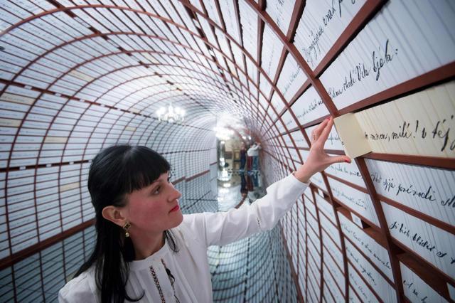 A guide opens a box ready to store a love story inside the Love Bank. (AFP) A guide opens a box ready to store a love story inside the Love Bank. (AFP)