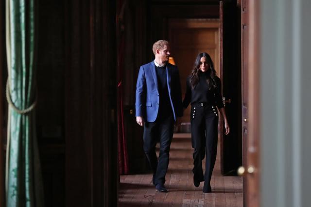 Britain's Prince Harry (L) and his fiancée actor Meghan Markle walk through the corridors of the Palace of Holyroodhouse. (AFP) Britain's Prince Harry (L) and his fiancée actor Meghan Markle walk through the corridors of the Palace of Holyroodhouse. (AFP)