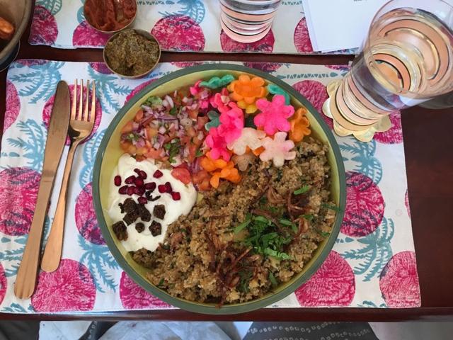 Quinoa biryani is served with a traditional onion and tomato kachumbar, a crispy okra raita and fryums
