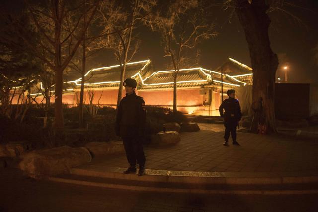 Policemen secure an area around Hou Hai lake in Beijing on February 15, 2018, ahead of the coming Lunar New Year, marking the Year of the Dog. (AFP Photo)