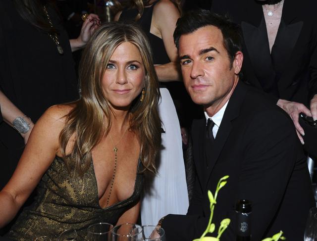 FILE - In this Jan. 25, 2015 file photo, Jennifer Aniston, left, and Justin Theroux pose in the audience at the 21st annual Screen Actors Guild Awards in Los Angeles. (Vince Bucci/Invision/AP)