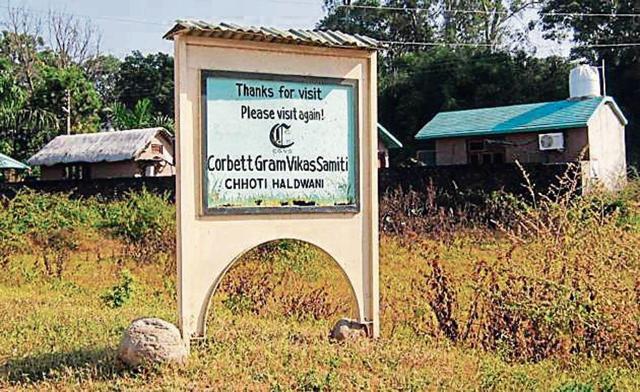 A sign in stone thanking visitors who come to this Jim Corbett Heritage Village in Nainital district. (HT File Photo)