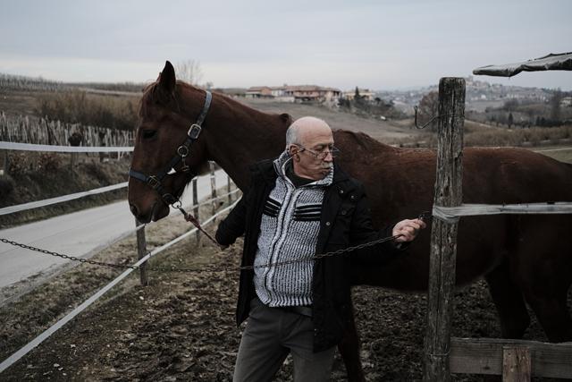 Anfosso holds his horse as he closes its pen. (AFP) Anfosso holds his horse as he closes its pen. (AFP)