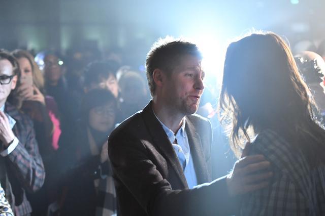 Burberry's outgoing chief creative officer and president Christopher Bailey greets guests at the end of the Burberry catwalk show. (AFP/ Ben Stansall)