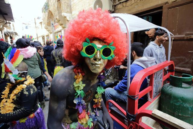 The tradition originated when an emigrant to Brazil returned to his native Tripoli bringing the carnival with him. (AFP) The tradition originated when an emigrant to Brazil returned to his native Tripoli bringing the carnival with him. (AFP)