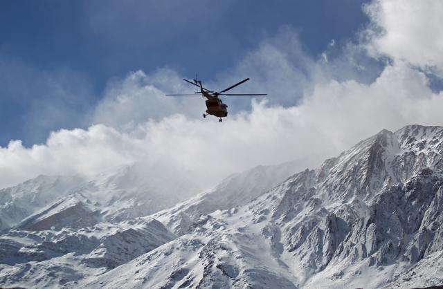 A handout picture released on February 19, 2018 by the Tasnim news agency shows members of a rescue team helicopter searching for the wreckage of Aseman Airlines flight EP3704 in Iran's Zagros mountain range. (AFP) A handout picture released on February 19, 2018 by the Tasnim news agency shows members of a rescue team helicopter searching for the wreckage of Aseman Airlines flight EP3704 in Iran's Zagros mountain range. (AFP)