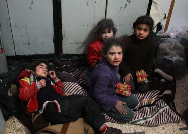Syrian children cry at a make-shift hospital in Douma following air strikes on the Syrian village of Mesraba. (AFP Photo) Syrian children cry at a make-shift hospital in Douma following air strikes on the Syrian village of Mesraba. (AFP Photo)