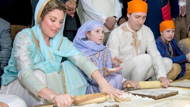 Justin Trudeau with his wife Sophie Grégoire Trudeau, son Xavier and daughter Ella-Grace prepare chapatis in the kitchen at Golden Temple in Amritsar on Wednesday. (HT Photo) Justin Trudeau with his wife Sophie Grégoire Trudeau, son Xavier and daughter Ella-Grace prepare chapatis in the kitchen at Golden Temple in Amritsar on Wednesday. (HT Photo)