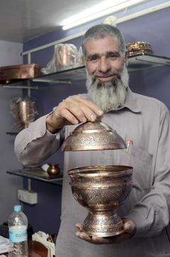 Aslam Bhatt shows one of his copper products. (RAVINDRA JOSHI/HT PHOTO) Aslam Bhatt shows one of his copper products. (RAVINDRA JOSHI/HT PHOTO)