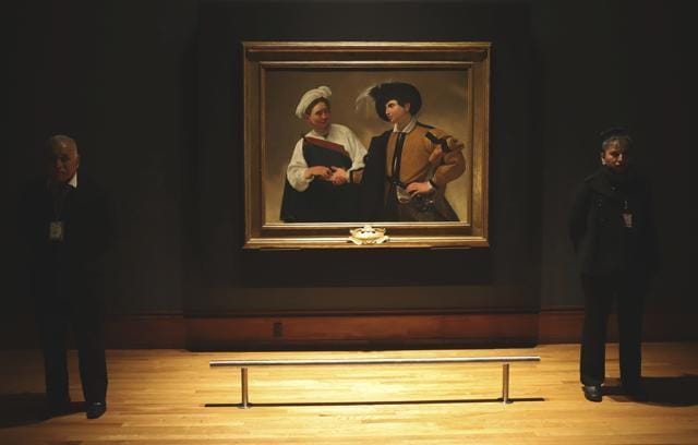 Museum workers stand next to 'La Buona Ventura' by Italian master Michelangelo Merisi da Caravaggio (1571-1610) during the opening of a Caravaggio exhibit at the National Art Museum in Mexico City. (AP) Museum workers stand next to 'La Buona Ventura' by Italian master Michelangelo Merisi da Caravaggio (1571-1610) during the opening of a Caravaggio exhibit at the National Art Museum in Mexico City. (AP)