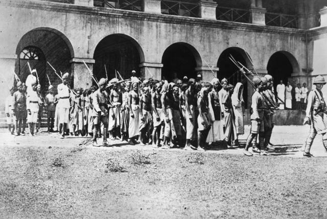 A 1925 photo of Mappila prisoners going to trial in Calicut for agitating against the British. In 1921-22, during a rebellion against the British as well as the feudal class – mostly Hindus – as many as 2,400 Mappilas were killed and nearly 40,000 surrendered when the revolt folded in disaster. (Getty Images) A 1925 photo of Mappila prisoners going to trial in Calicut for agitating against the British. In 1921-22, during a rebellion against the British as well as the feudal class – mostly Hindus – as many as 2,400 Mappilas were killed and nearly 40,000 surrendered when the revolt folded in disaster. (Getty Images)