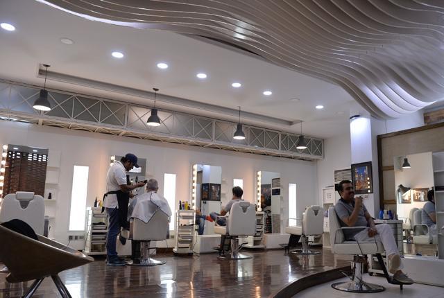 Nails are buffed, blackheads scrubbed and coffee sipped to the sound of clipping scissors inside the "Men's" salon in Pakistan's capital Islamabad. (AFP)