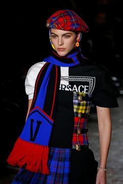 The loud and colourful looks by creative director Donatella Versace were part of “The Versace clan” collection. (REUTERS) The loud and colourful looks by creative director Donatella Versace were part of “The Versace clan” collection. (REUTERS)