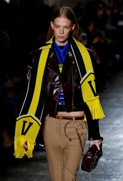 Versace did not fail to impress with bright tasselled dresses with matching earrings and short black outfits worn with tight belts with golden buckles. (REUTERS) Versace did not fail to impress with bright tasselled dresses with matching earrings and short black outfits worn with tight belts with golden buckles. (REUTERS)