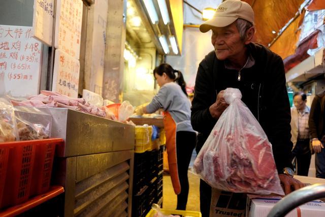 The Chinese meat industry adds around 150 million tonnes of carbon dioxide to the atmosphere every year. A man at a meat store in Mongkok district in Hong Kong, China. (REUTERS/Bobby Yip) The Chinese meat industry adds around 150 million tonnes of carbon dioxide to the atmosphere every year. A man at a meat store in Mongkok district in Hong Kong, China. (REUTERS/Bobby Yip)