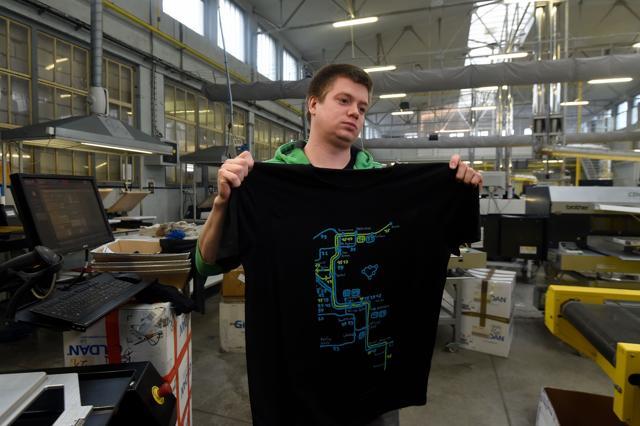 A worker of OP Tiger factory shows a T-shirt with a printed map designed by Matej Hosek. (AFP) A worker of OP Tiger factory shows a T-shirt with a printed map designed by Matej Hosek. (AFP)