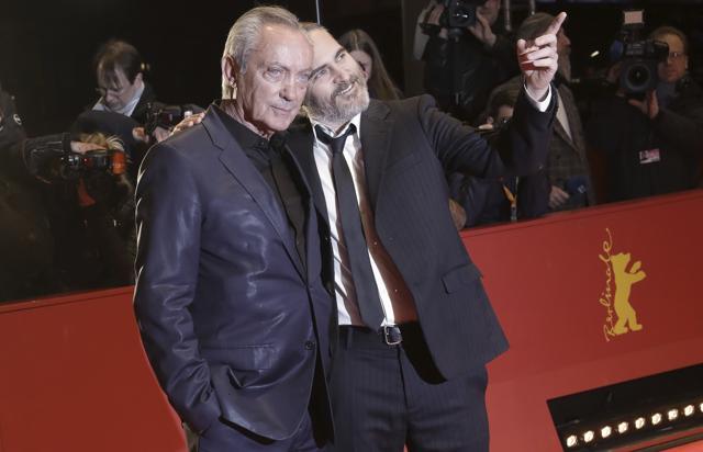 Actors Udo Kier and Joaquin Phoenix arrive for the screening of the film Don't Worry, He Won't Get Far On Foot. (AP)