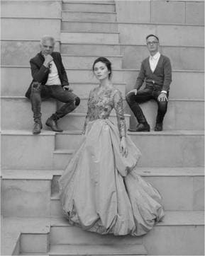 A model poses between Hemant Sagar and Didier Lecoanet of fashion house Lecoanet Hemant. A model poses between Hemant Sagar and Didier Lecoanet of fashion house Lecoanet Hemant.