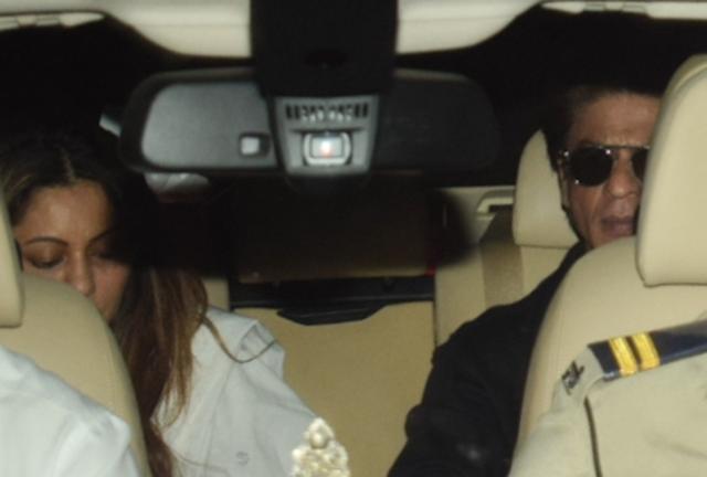 Mumbai: Actor Shah Rukh Khan arrives at actor Anil Kapoor's residence with his wife Gauri Khan. (IANS) Mumbai: Actor Shah Rukh Khan arrives at actor Anil Kapoor's residence with his wife Gauri Khan. (IANS)
