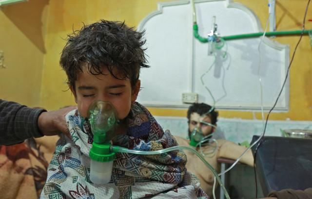 Syrian children and adults receive treatment for a suspected chemical attack at a makeshift clinic on the rebel-held village of al-Shifuniyah in the Eastern Ghouta region on the outskirts of the capital Damascus. (AFP Photo) Syrian children and adults receive treatment for a suspected chemical attack at a makeshift clinic on the rebel-held village of al-Shifuniyah in the Eastern Ghouta region on the outskirts of the capital Damascus. (AFP Photo)